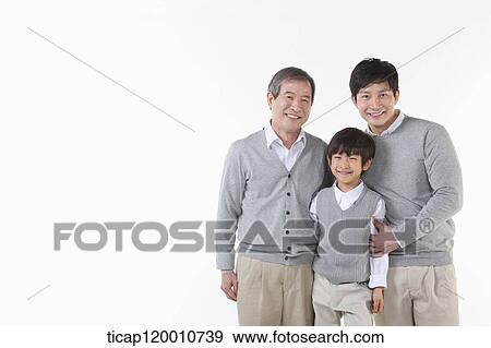 A family sitting on the couch View Large Photo Image Stock Photo - A family sitting on the couch. Fotosearch