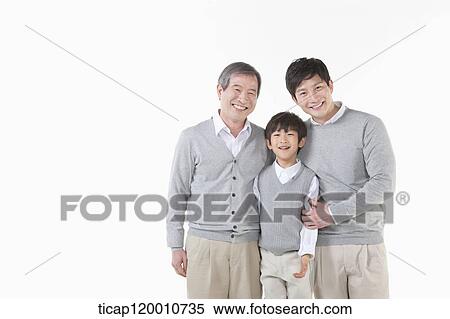 Stock Photography - A family sitting on the couch. Fotosearch