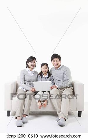 A family sitting with the laptop View Large Photo Image Stock Image - A family sitting with the laptop . Fotosearch
