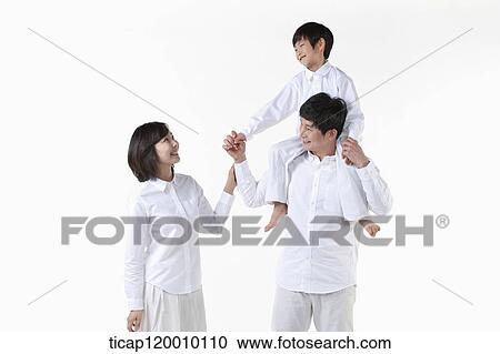 A family smiling together View Large Photo Image Stock Image - A family smiling together. Fotosearch