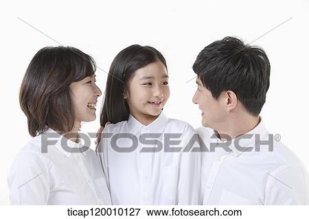 Stock Photo - A family smiling together. Fotosearch