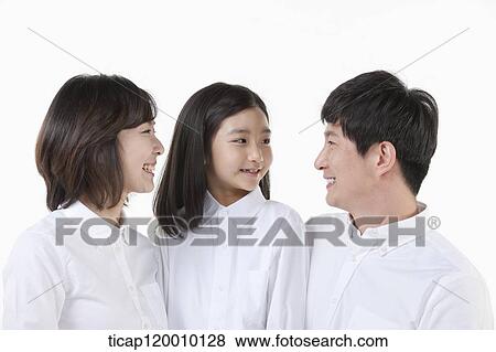 Stock Photo - A family smiling together. Fotosearch