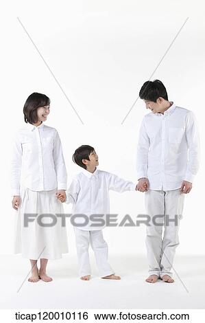 A family smiling together View Large Photo Image Stock Photograph - A family smiling together. Fotosearch