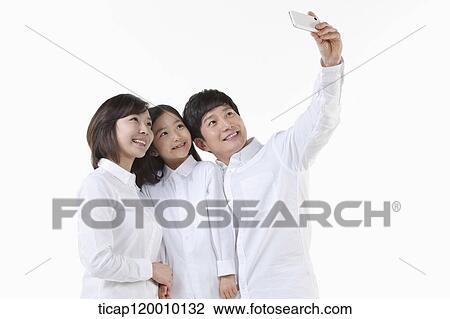 A family taking a picture together View Large Photo Image Stock Image - A family taking a picture together. Fotosearch