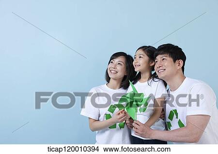 A family wearing recycling shirt with green pinwheel View Large Photo Image Picture - A family wearing recycling shirt with green pinwheel. Fotosearch