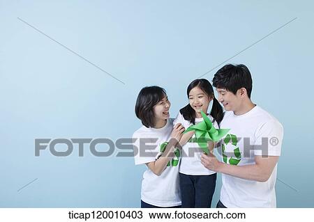 A family wearing recycling shirt with green pinwheel View Large Photo Image Stock Image - A family wearing recycling shirt with green pinwheel. Fotosearch