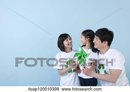 A family wearing recycling shirt with green pinwheel View Large Photo Image Stock Photo - A family wearing recycling shirt with green pinwheel. Fotosearch