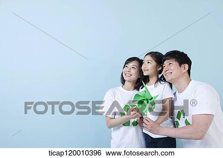 A family wearing recycling shirt with green pinwheel View Large Photo Image Stock Photograph - A family wearing recycling shirt with green pinwheel. Fotosearch