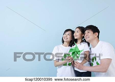 A family wearing recycling shirt with green pinwheel View Large Photo Image Stock Photography - A family wearing recycling shirt with green pinwheel. Fotosearch