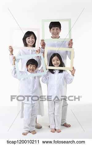 Stock Image - A family with colorful frames . Fotosearch