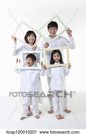 Stock Photo - A family with colorful frames . Fotosearch