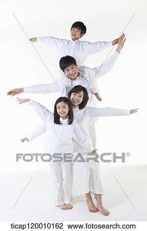 Stock Image - A family with their arms open. Fotosearch