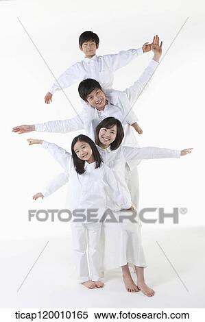 Stock Photography - A family with their arms open. Fotosearch