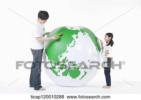 A father and daughter painting a green globe View Large Photo Image Stock Photo - A father and daughter painting a green globe. Fotosearch