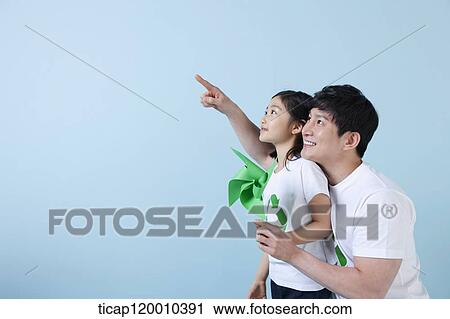 A father and daughter with a green pinwheel View Large Photo Image Stock Image - A father and daughter with a green pinwheel. Fotosearch