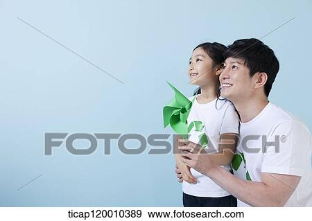 A father and daughter with a green pinwheel View Large Photo Image Stock Photo - A father and daughter with a green pinwheel. Fotosearch