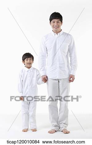 A father and son holding hands together View Large Photo Image Picture - A father and son holding hands together. Fotosearch