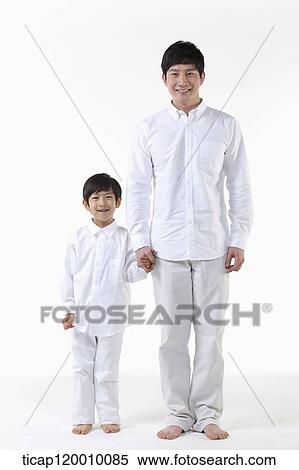 A father and son holding hands together View Large Photo Image Stock Photography - A father and son holding hands together. Fotosearch