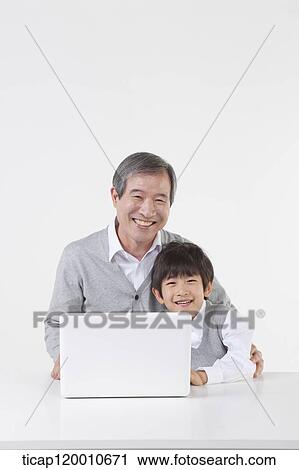 A father and son hugging together View Large Photo Image Stock Image - A father and son hugging together. Fotosearch