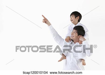 A father and son looking at the sky View Large Photo Image Picture - A father and son looking at the sky . Fotosearch