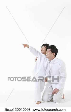 A father and son looking at the sky View Large Photo Image Stock Photo - A father and son looking at the sky . Fotosearch