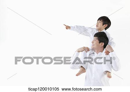 A father and son looking at the sky View Large Photo Image Stock Photography - A father and son looking at the sky . Fotosearch