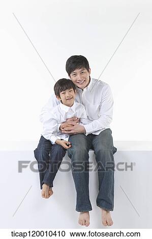 A father and son smiling together View Large Photo Image Stock Image - A father and son smiling together. Fotosearch