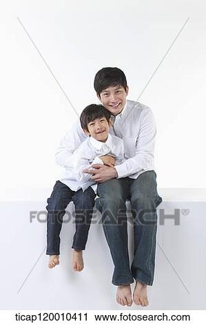 A father and son smiling together View Large Photo Image Stock Image - A father and son smiling together. Fotosearch
