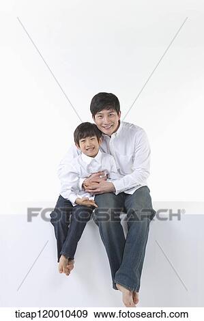 A father and son smiling together View Large Photo Image Stock Photo - A father and son smiling together. Fotosearch