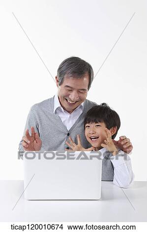 A father and son with a green frame View Large Photo Image Picture - A father and son with a green frame. Fotosearch