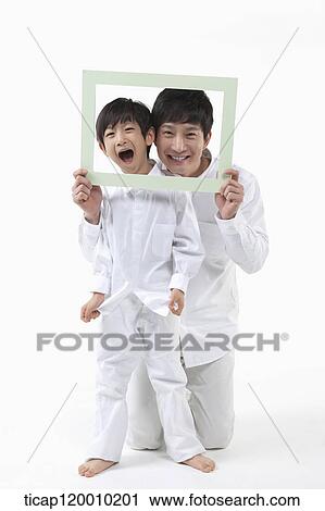A father and son with a green frame View Large Photo Image Stock Image - A father and son with a green frame. Fotosearch