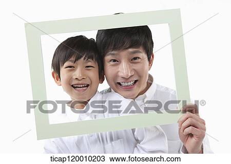 A father and son with a green frame View Large Photo Image Stock Image - A father and son with a green frame. Fotosearch