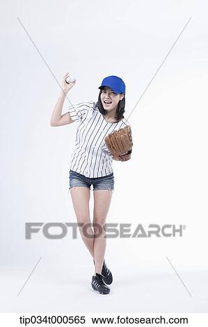 A female baseball player pitching a ball View Large Photo Image Stock Photography - A female baseball player pitching a ball. Fotosearch