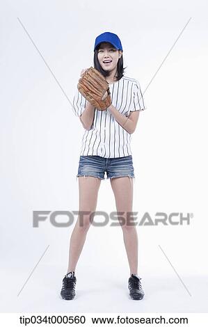 A female baseball player with a ball and glove View Large Photo Image Stock Image - A female baseball player with a ball and glove. Fotosearch