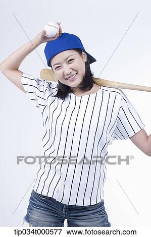 A female baseball player with a ball and bat View Large Photo Image Stock Photo - A female baseball player with a ball and bat. Fotosearch