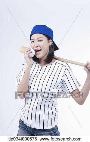 A female baseball player with a ball and bat View Large Photo Image Stock Photography - A female baseball player with a ball and bat. Fotosearch