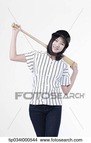 A female baseball player with a bat View Large Photo Image Picture - A female baseball player with a bat. Fotosearch