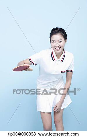 Stock Photo - A female ping-pong player with a racket. Fotosearch