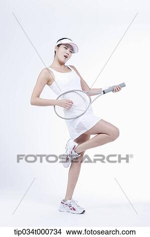 A female tennis player playing the racket View Large Photo Image Picture - A female tennis player playing the racket. Fotosearch