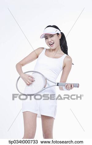 A female tennis player playing the racket View Large Photo Image Stock Image - A female tennis player playing the racket. Fotosearch