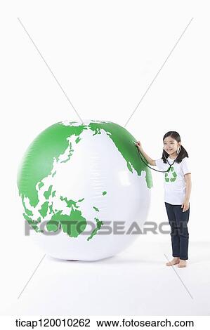 A girl caring a green globe View Large Photo Image Stock Image - A girl caring a green globe. Fotosearch