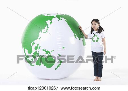 A girl caring a green globe View Large Photo Image Stock Photo - A girl caring a green globe. Fotosearch