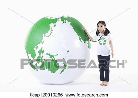 Stock Photograph - A girl caring a green globe. Fotosearch