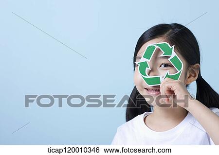 A girl holding a recycling symbol View Large Photo Image Stock Photograph - A girl holding a recycling symbol . Fotosearch