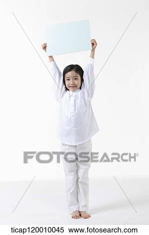 A girl holding up white board View Large Photo Image Stock Photography - A girl holding up white board. Fotosearch