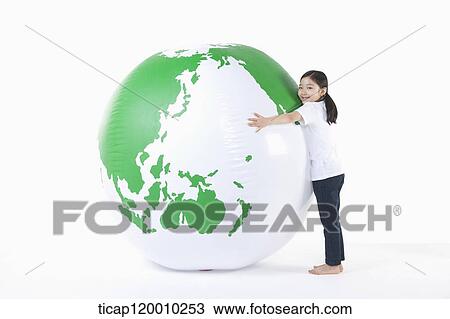 A girl hugging a green globe View Large Photo Image Stock Image - A girl hugging a green globe. Fotosearch