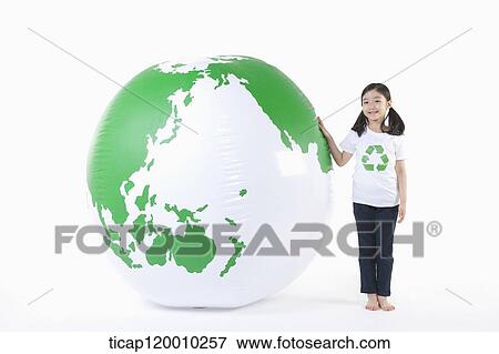 A girl in recycling shirt and a green globe View Large Photo Image Stock Photo - A girl in recycling shirt and a green globe. Fotosearch