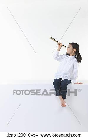 A girl looking the sky through the telescope View Large Photo Image Picture - A girl looking the sky through the telescope. Fotosearch