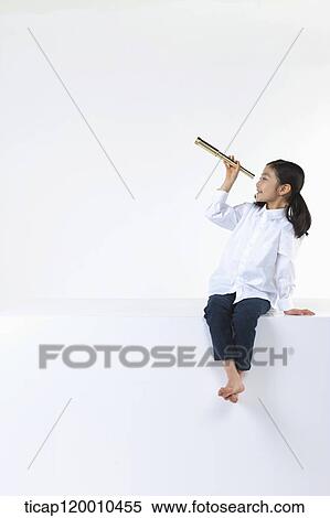 A girl looking the sky through the telescope View Large Photo Image Stock Photography - A girl looking the sky through the telescope. Fotosearch