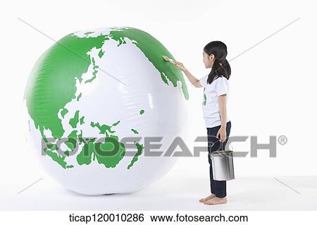 Stock Photograph - A girl painting a green globe. Fotosearch